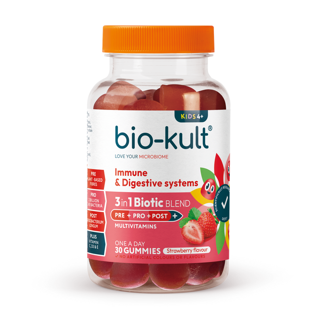 Healthy child holding a strawberry-flavoured Bio-Kult 3-in-1 Biotic Blend gummy for kids with colourful packaging