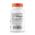 A detailed view of the capsules highlighting their size and the product's branding on the bottle