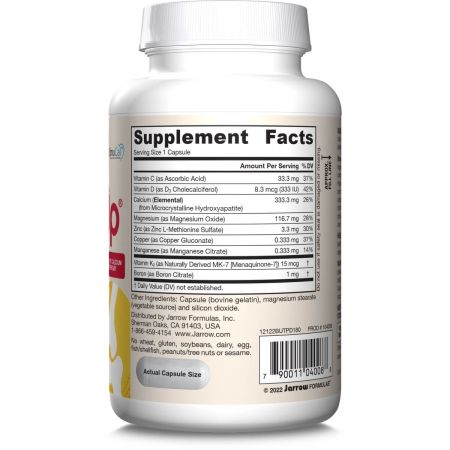 Close-up of three capsules of BoneUp supplement showing natural ingredients and capsule texture