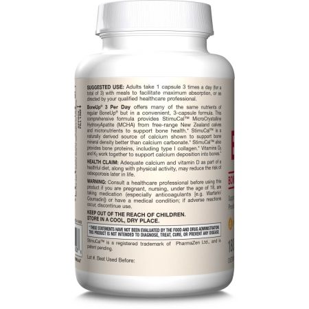 A hand holding three capsules of BoneUp with detailed label showing nutrients for bone health