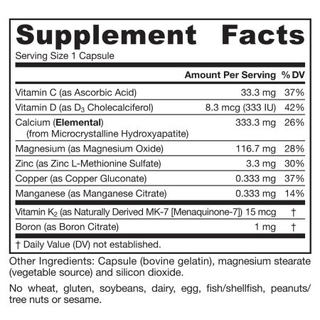 A container of BoneUp capsules open, revealing capsules filled with micronutrients and calcium compounds
