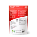 Photograph of the 220g package of Planet Paleo Keto C8 MCT Powder placed next to a smoothie, illustrating its versatile application for ketogenic diets