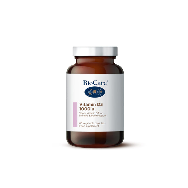 A close-up of Biocare Vitamin D3- 1000IU capsules in a clear container, highlighting the vegetarian capsules made from lichen, designed for immune support and bone health