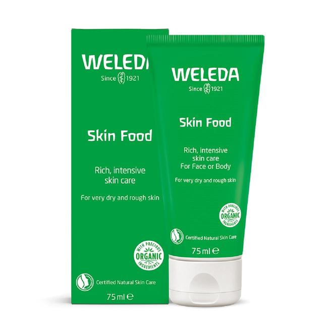 A 75ml tube of Weleda Skin Food, a versatile green cream with natural plant extracts including chamomile, calendula, and rosemary, designed to deeply nourish and soothe dry, rough skin on the face, elbows, hands, and feet