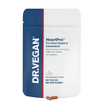 A close-up of DR VEGAN HeartPro® capsules showing their grey, cylindrical shape with a smooth surface