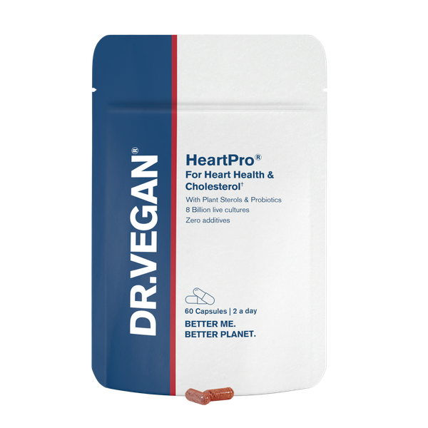 A close-up of DR VEGAN HeartPro® capsules showing their grey, cylindrical shape with a smooth surface