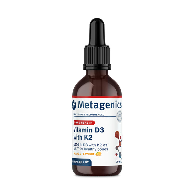 A detailed shot of the liquid drops from the Metagenics Vitamin D3 and K2 supplement showing the pleasant orange tint