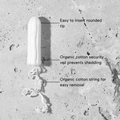 Close-up of &Sisters Naked Tampons showing biodegradable packaging and natural cotton material for sustainable menstrual protection