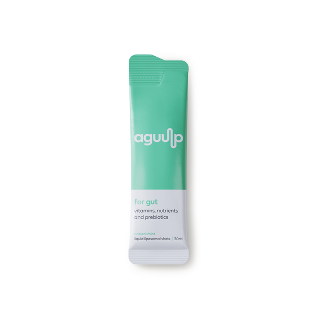Aguulp Gut 7x30ml sachets displayed with fresh mint and a glass of water, highlighting gut health benefits
