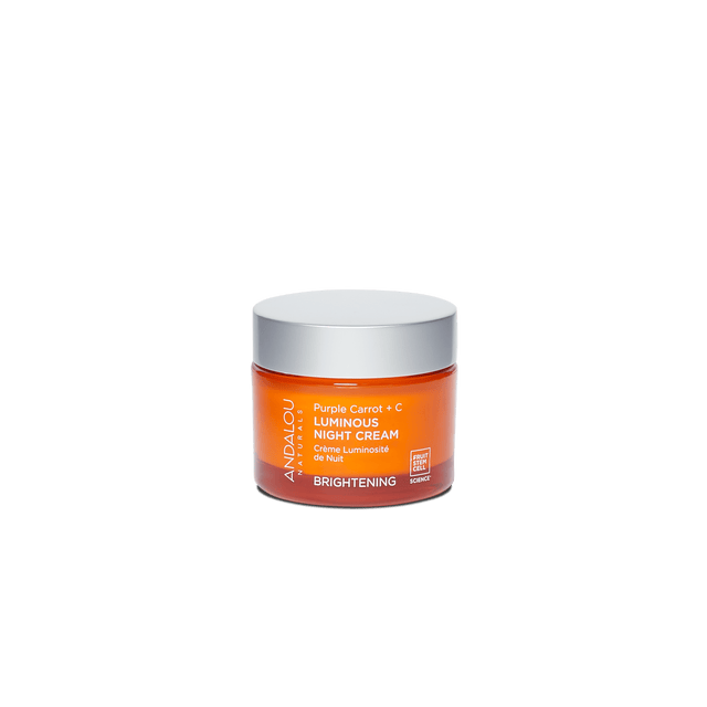Close-up of the cream's jar with visible ingredients such as purple carrot root extract, vitamin C, and bioactive berry complex emphasizing its nourishing, antioxidant-rich formula for dull, pigmentation-prone skin