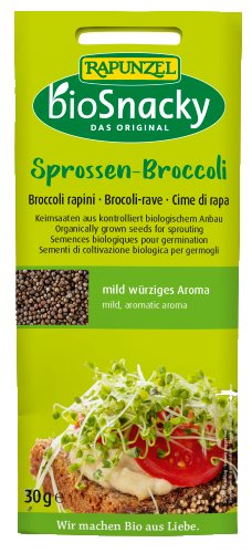 A close-up of fresh broccoli sprouts in a transparent tray, showcasing vibrant green, nutritious young broccoli plants rich in antioxidants and vitamins, ready to be added to salads and dishes