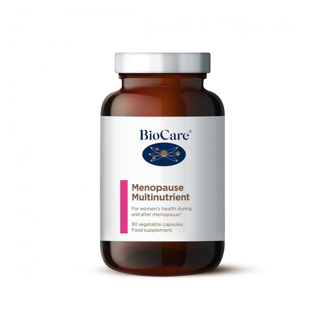A close-up of Biocare Menopause Multinutrient capsules, showing three vegetable capsules containing high-potency vitamins, minerals, green tea extract, and lycopene for supporting women's health during and after menopause