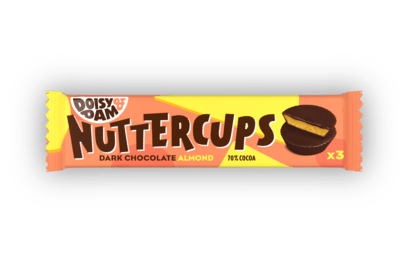 A close-up of Doisy & Dam Dark Chocolate Almond Nuttercups showing a smooth almond filling inside a 70% dark chocolate cup