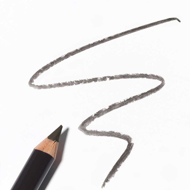 Application of Dr Hauschka Eye Definer taupe along the upper lash line, demonstrating soft smudging and eye enhancement