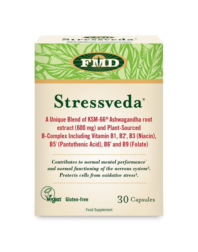 A bottle of FMD Stressveda 30 capsules featuring a label highlighting a blend of Ashwagandha root extract and plant-sourced B-vitamins, with fresh vegetables and mushrooms surrounding the product, emphasising natural ingredients and stress support benefits