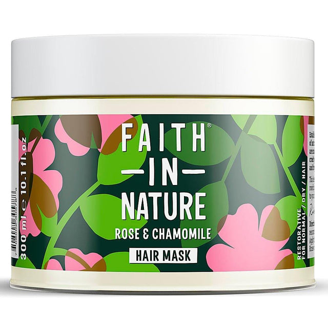A 300ml bottle of Faith in Nature Wild Rose and Chamomile Restoring Hair Mask with floral ingredients, including rosehip oil and chamomile extract, designed for nourishing and revitalising hair