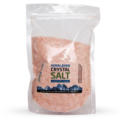 Himalayan crystal salt granules in a jar, highlighting the fine, natural pinkish-white crystals ideal for cooking and table use