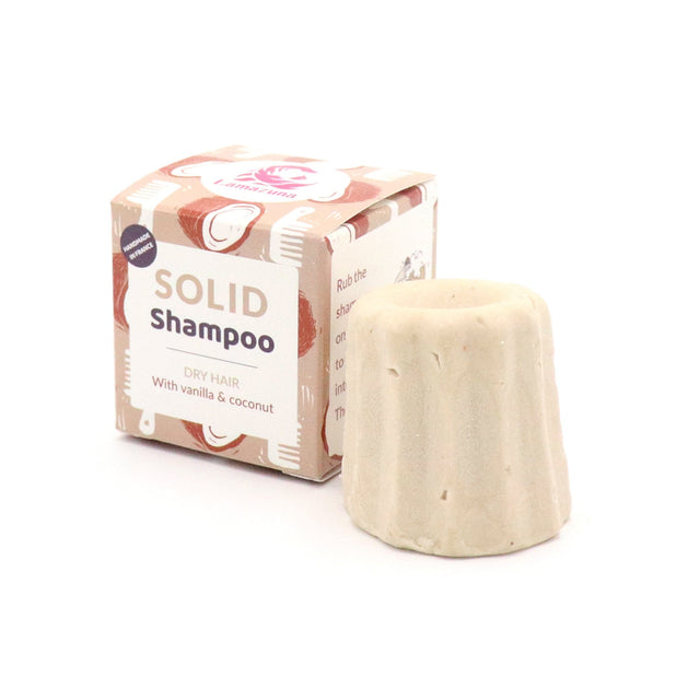A close-up of Lamazuna Solid Shampoo bar for dry hair with orange and vanilla coconut scents, showing its natural ingredients and eco-friendly packaging