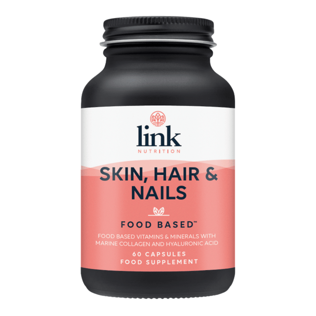A close-up of Link Nutrition Skin, Hair, & Nails capsules featuring a variety of natural ingredients including hyaluronic acid, bamboo extract, chaga mushroom, and essential vitamins for healthy skin, shiny hair, and strong nails