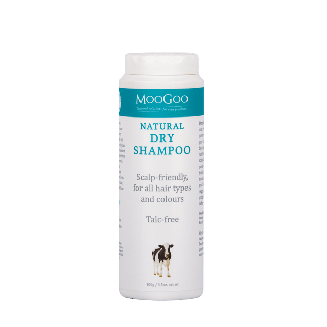 A 100g MooGoo Natural Dry Shampoo powder in a shaker bottle, featuring natural ingredients like corn and tapioca starch for oil absorption and a gentle, chemical-free formula suitable for all hair types
