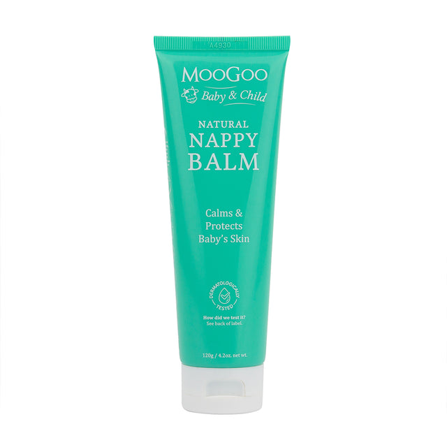 A 120g MooGoo Natural Nappy Balm tube with a label highlighting its soothing, anti-yeast, and natural ingredients for gentle baby skin around the nappy area