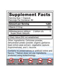 Close-up of the probiotic capsules in a transparent container, highlighting the dairy-free formula and supplement details