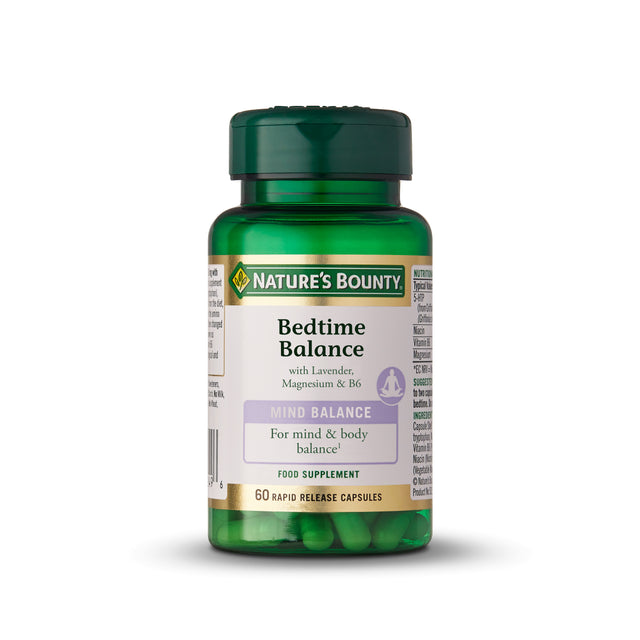 A bottle of Nature's Bounty Bedtime Balance capsules with labelled packaging, featuring 60 vegetarian capsules designed to support mental balance, relaxation, and sleep quality through 5-HTP, niacin, and vitamin B6