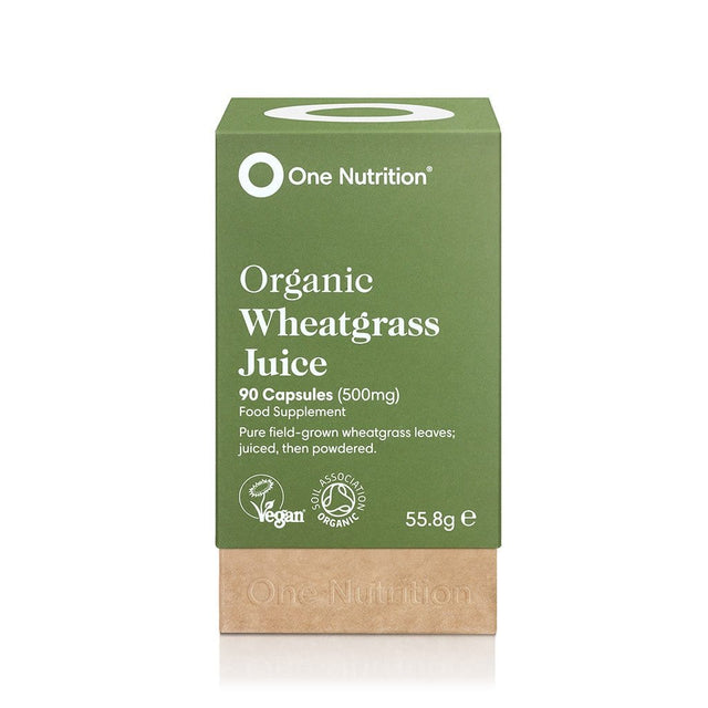 A close-up image of One Nutrition Wheatgrass Juice capsules, highlighting their organic, nutrient-rich formula made from freshly-juiced wheatgrass leaves in a clear container