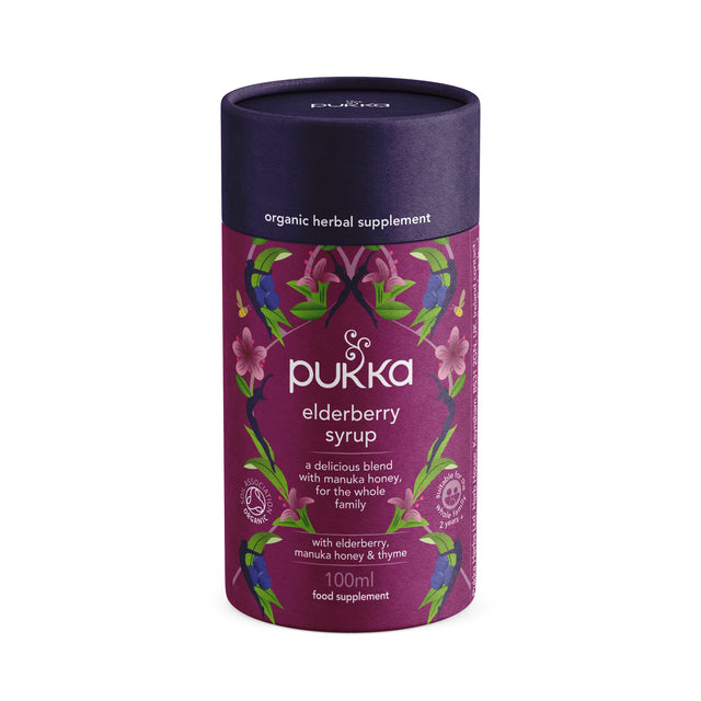 A 100ml bottle of Pukka Elderberry Syrup featuring a natural liquid with elderberry juice, manuka honey, thyme, trikatu, and other herbs, designed to support seasonal immune health