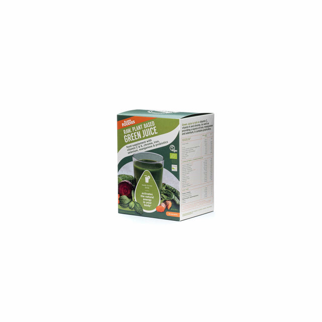 Arrangement of Superfoodies Green Juice sachets alongside organic vegetables and herbs used in the formula