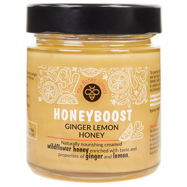 Rich jar of Honey Lovers Honeyboost Ginger & Lemon Honey showcasing its creamy texture and natural ingredients