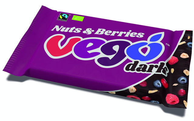 A 85g Vego Organic Dark Nuts & Berries vegan chocolate bar featuring dark chocolate with chopped almonds, hazelnuts, blueberry drops, raspberry and cranberry pieces, showcasing high-quality, organic, Fairtrade ingredients with a rich cocoa content of at least 60%