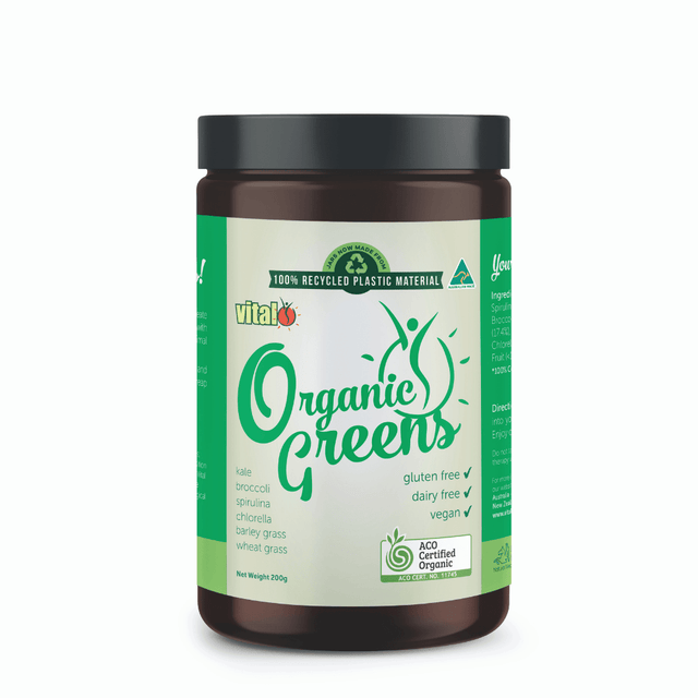 A close-up of Vital Organic Greens powder in a jar, showcasing its vibrant green colour and textured blend of organic raw greens including spirulina, kale, broccoli, barley grass, wheat grass, and chlorella, highlighting its natural, nutrient-rich composition for boosting energy and overall health