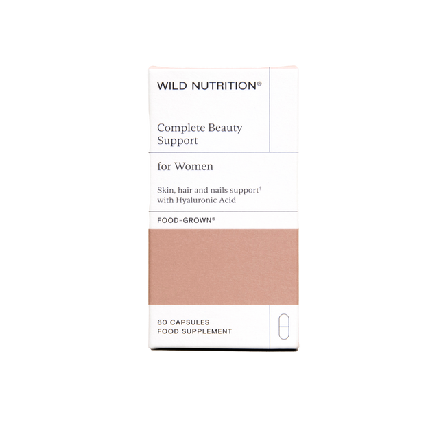 Close-up of the capsules from Wild Nutrition Complete Beauty Support Jar highlighting hyaluronic acid, vitamins, and botanicals