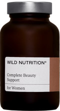 Richly detailed image of the Wild Nutrition Complete Beauty Support Jar with 60 capsules showing the label and capsules inside
