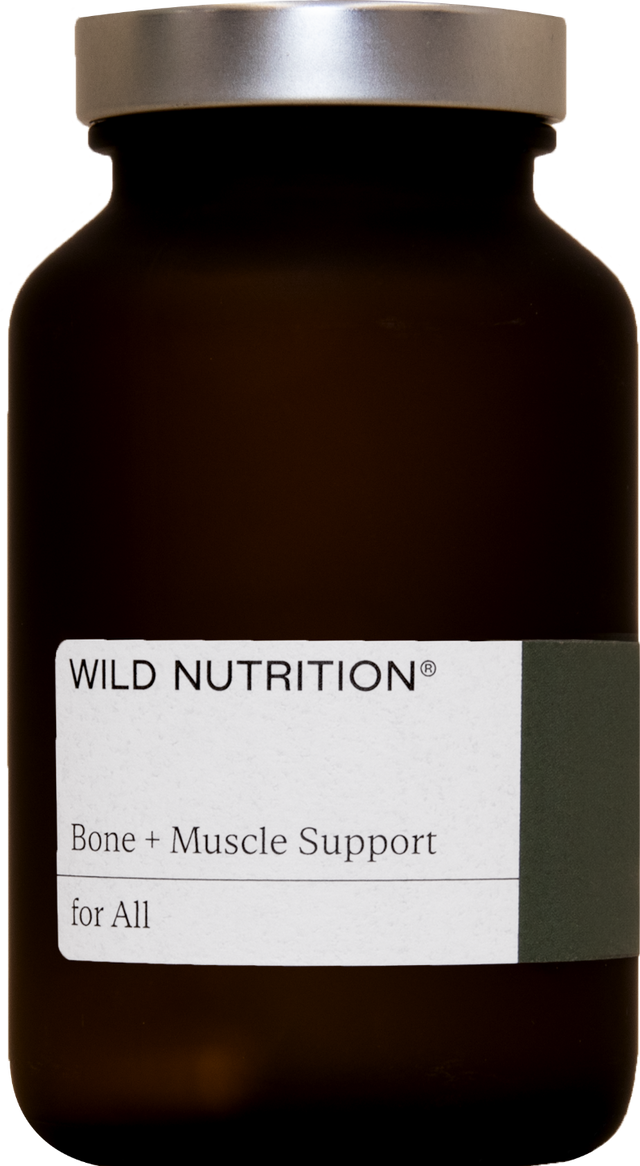 A close-up of Wild Nutrition Bone & Muscle Support capsules showing their size and shape