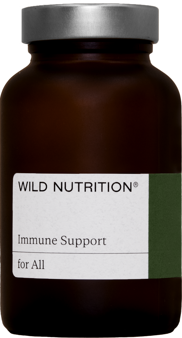 Fresh capsules of Wild Nutrition Iron Plus with natural food-based iron, vitamin C, and bioflavonoids inside a glass jar