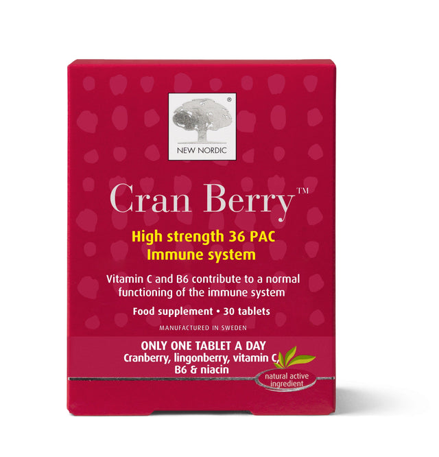 A close-up of New Nordic Cran Berry tablets showing the packaging and supplement facts on a white background, highlighting the cranberry extract, black pepper, vitamins, and the 30-tablet bottle for immune support and mucous membrane health
